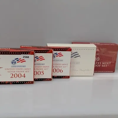 Sale Photo Thumbnail #1064: Collection of United States Mint Silver Proof Sets in original packaging, dated 2004 through 2010.
