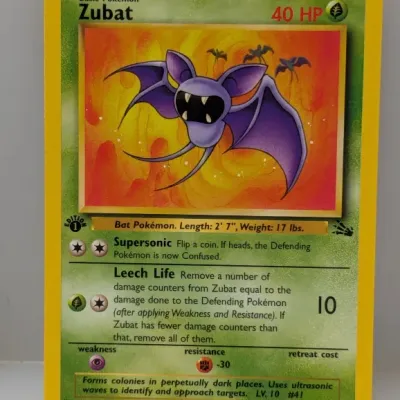 Sale Photo Thumbnail #811: 1st Edition Zubat Pokémon trading card from the Fossil expansion, numbered 57/62, released in 1999.