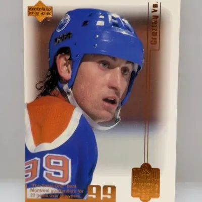 Sale Photo Thumbnail #751: 1990s Upper Deck Gretzky Vs. Wayne Gretzky Edmonton Oilers hockey trading card with gold foil stamping.
