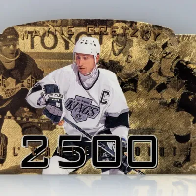 Sale Photo Thumbnail #525: 1995-96 Upper Deck SP Gold Wayne Gretzky '2500 NHL Career Points' die-cut trading card featuring him in his Los Angeles Kings jersey.