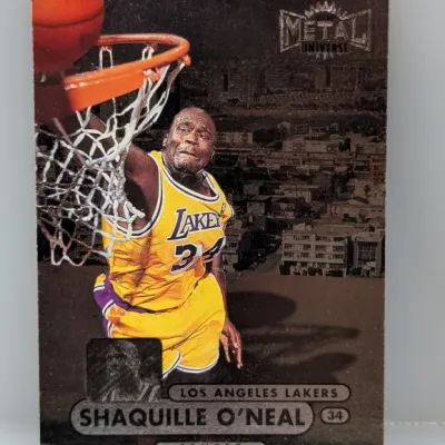 Sale Photo Thumbnail #529: 1997-98 SkyBox Metal Universe Shaquille O'Neal trading card #34 featuring the Los Angeles Lakers center.