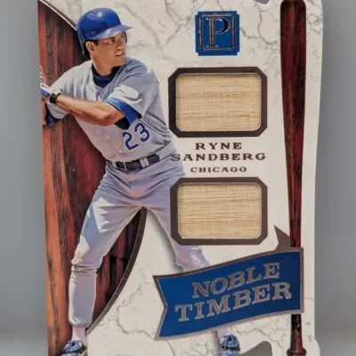 Sale Photo Thumbnail #487: Panini Peerless Noble Timber Ryne Sandberg game-used bat relic card featuring two bat swatches.