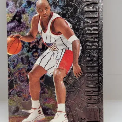 Sale Photo Thumbnail #573: 1996-97 Fleer Metal Universe Charles Barkley basketball trading card featuring a metallic diamond plate textured background.