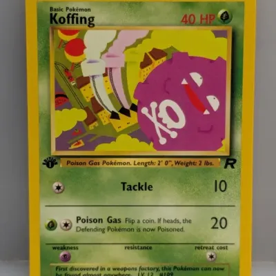 Sale Photo Thumbnail #653: 1st Edition Koffing Pokémon trading card from the Team Rocket expansion set, numbered 58/82 and dated 1999-2000 Wizards of the Coast.