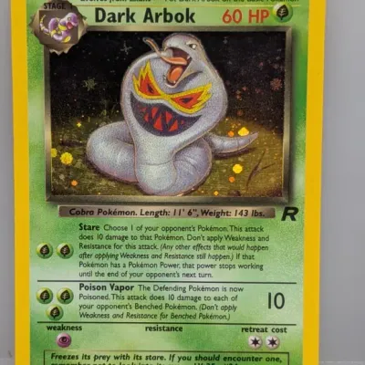 Sale Photo Thumbnail #50: Holographic Dark Arbok Pokémon trading card (2/82) from the 2000 Team Rocket set.