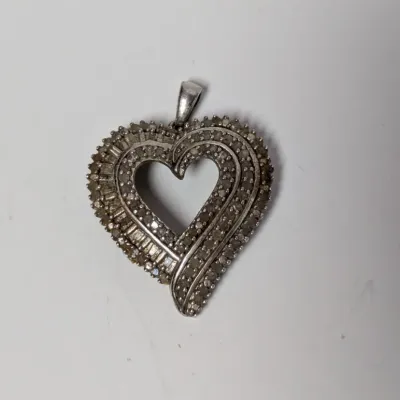 Sale Photo Thumbnail #988: Sterling silver and pave diamond open-heart pendant with baguette accents.