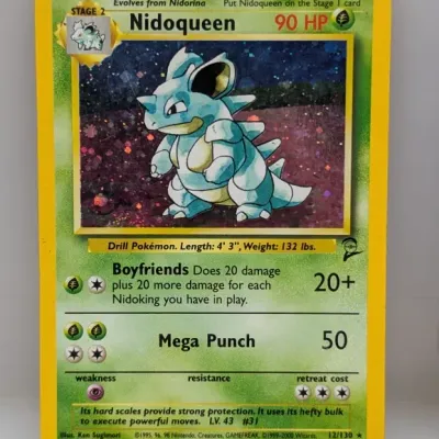 Sale Photo Thumbnail #795: Holographic Nidoqueen 12/130 Pokémon trading card from the Base Set 2 series, released in 2000.