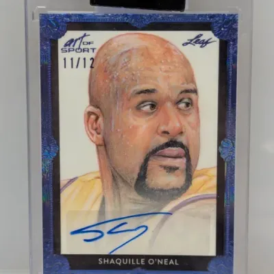Sale Photo Thumbnail #43: Leaf Art of Sport Shaquille O'Neal autographed trading card, numbered 11/12, encased in a protective hard case.