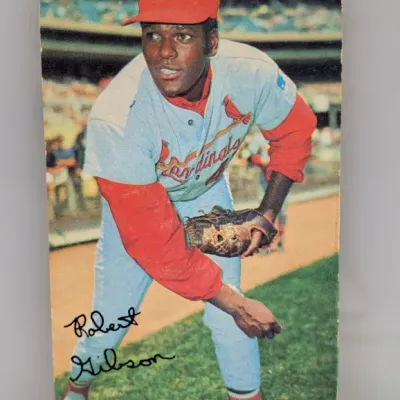 Sale Photo Thumbnail #149: Vintage Bob Gibson St. Louis Cardinals baseball trading card featuring a printed signature and rounded corners, showing light edge wear.