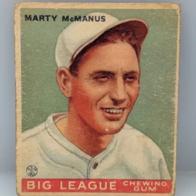 Sale Photo Thumbnail #409: 1933 Goudey Big League Chewing Gum baseball card (#222) featuring Marty McManus. The card shows vintage surface wear and edge softening consistent with age.