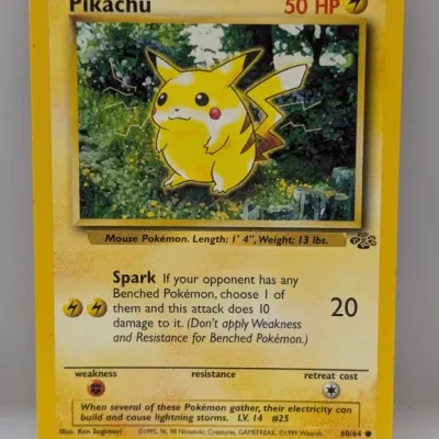 Sale Photo Thumbnail #500: 1999 Wizards of the Coast Pokémon Jungle set Pikachu trading card, #60/64, featuring artwork by Ken Sugimori.