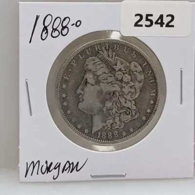 Sale Photo Thumbnail #1033: 1888-O Morgan silver dollar coin housed in a protective cardboard flip holder.
