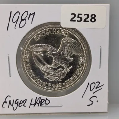 Sale Photo Thumbnail #1019: 1987 Engelhard one troy ounce .999 fine silver round in cardboard flip holder.