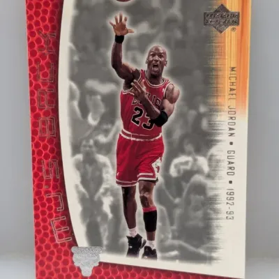 Sale Photo Thumbnail #803: 1992-93 Upper Deck Michael Jordan 'He's Back' basketball card #23, featuring him in his red Chicago Bulls uniform.
