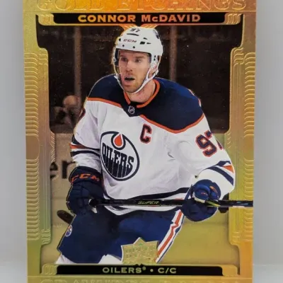 Sale Photo Thumbnail #256: Upper Deck Gold Etchings Connor McDavid hockey trading card featuring the Edmonton Oilers captain in pristine condition.