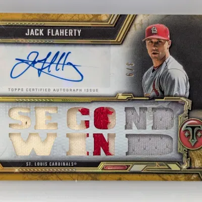 Sale Photo Thumbnail #294: Topps Triple Threads Jack Flaherty autographed game-used memorabilia card, numbered 3/9, featuring 'SECOND WIN' jersey patch cutouts.