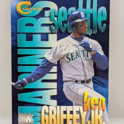 Sale Photo Thumbnail #531: 1997 Circa Boss Ken Griffey Jr. Seattle Mariners baseball card featuring bold graphic lettering and full-bleed action photography.