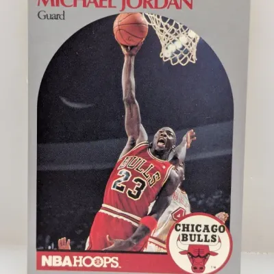 Sale Photo Thumbnail #905: 1990-91 NBA Hoops Michael Jordan #65 trading card featuring the Chicago Bulls guard in action.
