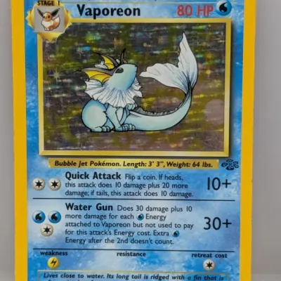 Sale Photo Thumbnail #258: 1999 Pokémon Jungle set Vaporeon holo trading card (12/64).