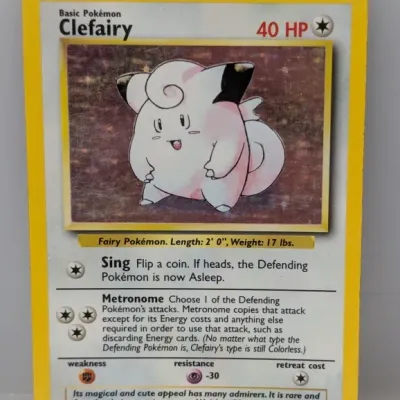 Sale Photo Thumbnail #138: 1999 Pokémon Base Set holographic Clefairy trading card, number 5/102, illustrated by Ken Sugimori.