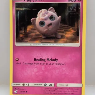Sale Photo Thumbnail #772: 2019 Pokémon Detective Pikachu Jigglypuff holo trading card, set number 14/18, in good condition.