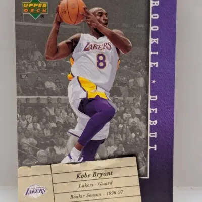 Sale Photo Thumbnail #545: 1996-97 Upper Deck Kobe Bryant Rookie Debut basketball card in good condition.