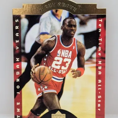 Sale Photo Thumbnail #860: 1998-99 Upper Deck Michael Jordan "A Cut Above" insert trading card, die-cut featuring gold foil detailing.