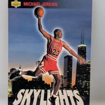 Sale Photo Thumbnail #883: 1993-94 Upper Deck Michael Jordan Skylights basketball trading card featuring the Chicago Bulls star against a skyline background.