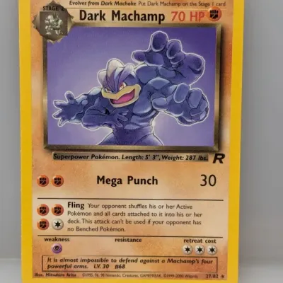 Sale Photo Thumbnail #837: Dark Machamp #27/82 Pokémon card from the 2000 Team Rocket set, illustrated by Mitsuhiro Arita.