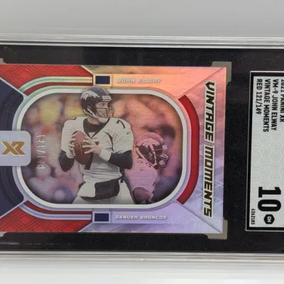 Sale Photo Thumbnail #155: SGC-graded 10 Gem Mint 2021 Panini XR John Elway Vintage Moments Red trading card, numbered 121/149.