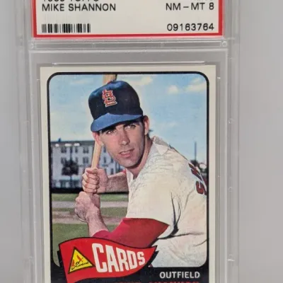 Sale Photo Thumbnail #201: 1965 Topps Mike Shannon #43 baseball card, PSA graded NM-MT 8 in a protective slab.