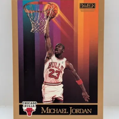 Sale Photo Thumbnail #695: 1990-91 SkyBox Michael Jordan Chicago Bulls trading card #41 featuring a gold border and vibrant colorful background.