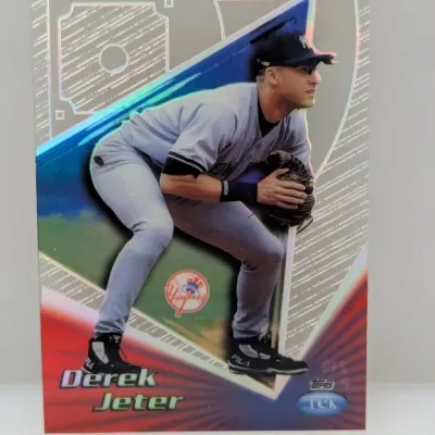 Sale Photo Thumbnail #595: 1999 Topps Tek Derek Jeter baseball trading card featuring a holographic foil design and the New York Yankees shortstop in fielding stance.
