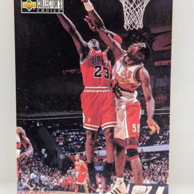 Sale Photo Thumbnail #833: 1990s Upper Deck Collector's Choice Michael Jordan basketball trading card, featuring an action shot against the Atlanta Hawks.