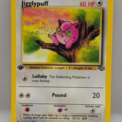 Sale Photo Thumbnail #683: 1999 Pokémon Jungle 1st Edition Jigglypuff trading card #54/64, illustrated by Kagemaru Himeno.