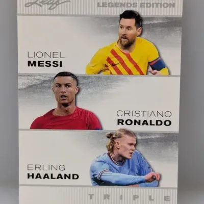 Sale Photo Thumbnail #474: Leaf Exclusive Legends Edition Triple trading card featuring Lionel Messi, Cristiano Ronaldo, and Erling Haaland in good condition.