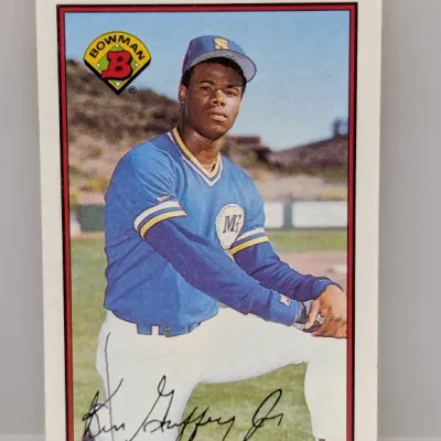 Sale Photo Thumbnail #911: 1989 Bowman Ken Griffey Jr. rookie trading card (#220) featuring the Seattle Mariners star in good overall condition.