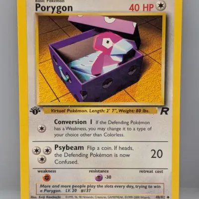 Sale Photo Thumbnail #598: 1st Edition Team Rocket set Porygon Pokémon trading card, numbered 48/82, illustrated by Keiji Kinebuchi, released in 2000.