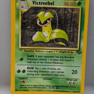Sale Photo Thumbnail #778: 1999 Pokémon Jungle Set holographic Victreebel trading card (#14/64), featuring artwork by Ken Sugimori.