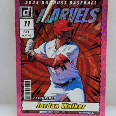 Sale Photo Thumbnail #892: 2023 Donruss Baseball Marvels Jordan Walker insert trading card featuring a vibrant pink holographic border.