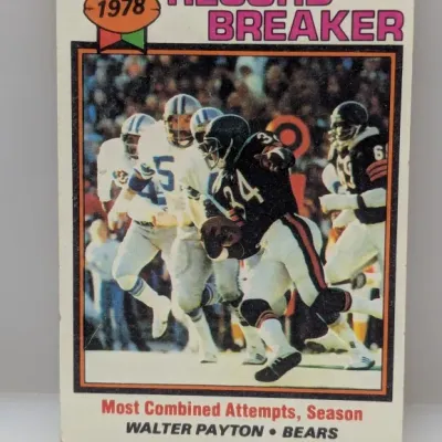 Sale Photo Thumbnail #647: 1978 Topps Walter Payton Record Breaker football card #2, featuring 'Most Combined Attempts, Season'. The vintage card shows light edge wear and soft corners.