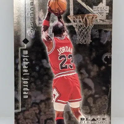 Sale Photo Thumbnail #273: 1997-98 Upper Deck Black Diamond Michael Jordan basketball trading card, featuring a textured silver foil design with Jordan in his red Chicago Bulls jersey.