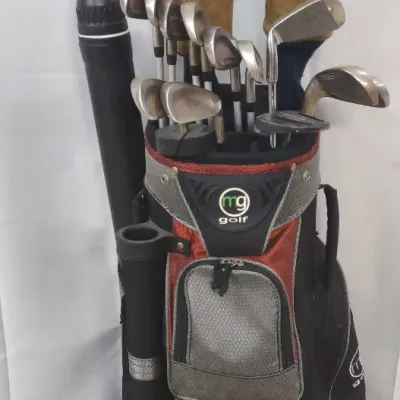MG Golf cart bag filled with a mixed set of golf clubs, headcovers, and a ball retriever attachment.