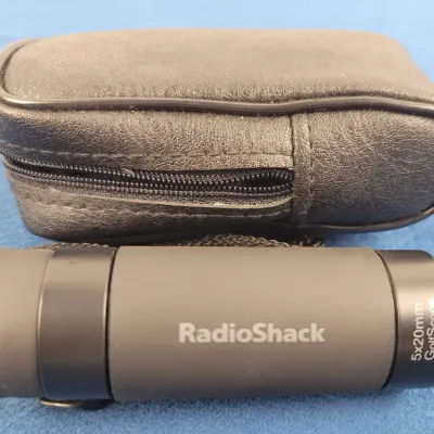 RadioShack 5x20mm GolfScope monocular with a black zippered leatherette carrying case.