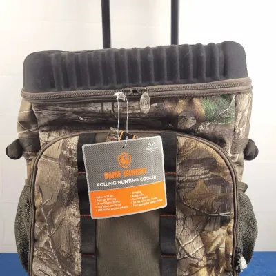 Game Winner rolling soft-sided hunting cooler featuring a camouflage pattern, extended handle, and original retail hangtag.