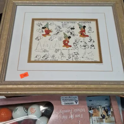 Framed Disney limited edition print depicting model sheet sketches for The Sorcerer's Apprentice featuring Mickey Mouse, displayed...
