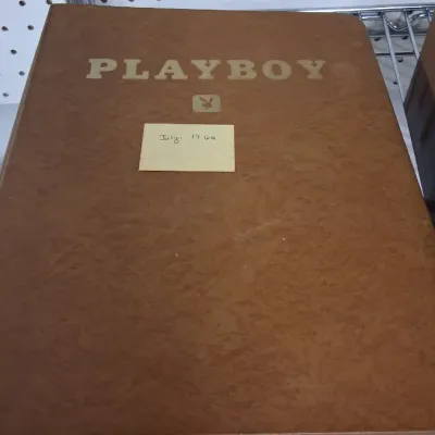 Vintage hardbound Playboy magazine volume with embossed gold lettering, labeled July 1969 on a handwritten sticky note.