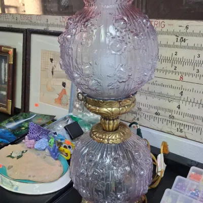 Vintage Gone with the Wind style parlor lamp featuring embossed floral pink glass globes and an ornate brass base.