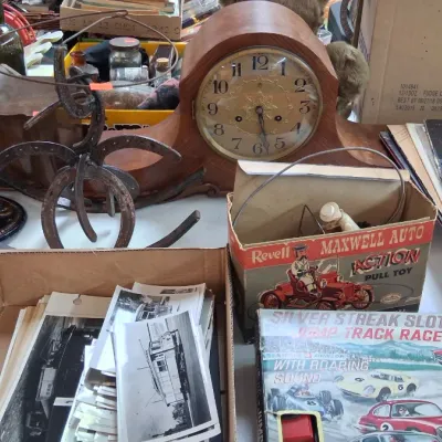 Collection of vintage items including wooden mantel clocks, a Revell Maxwell Auto pull toy in box, vintage photographs, vinyl records,...