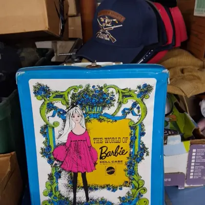 Vintage 1968 Mattel 'The World of Barbie' vinyl doll carrying case in bright blue, featuring illustrated artwork of Barbie in a...
